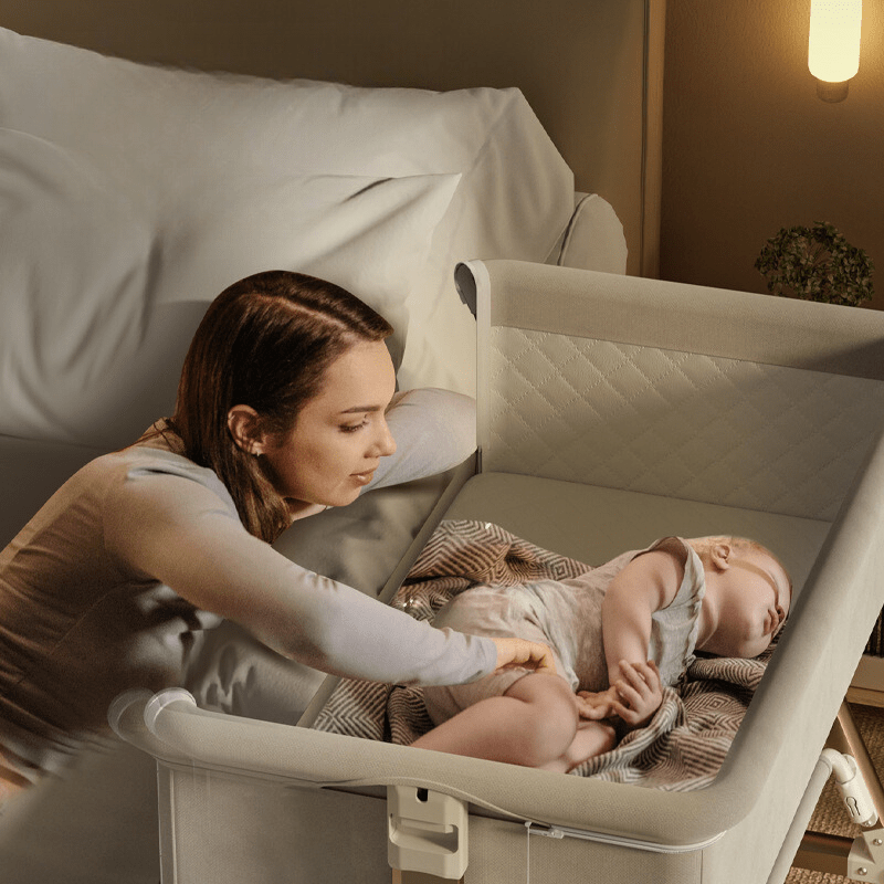 Portable Baby Bassinet with Nursing Table and Storage Features